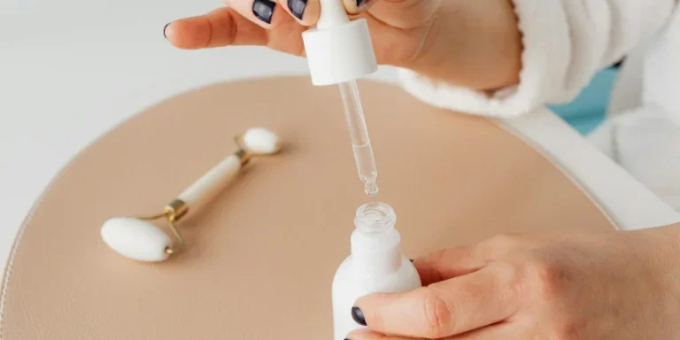 Close-up of Woman Holding a Pipette with Cosmetic Product