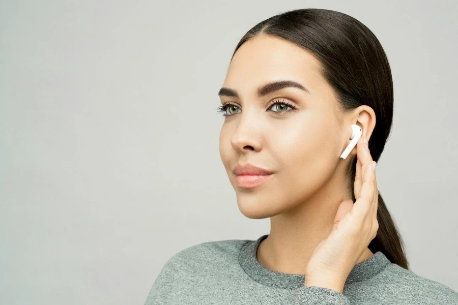 Photo Of Woman Touching Her Ear