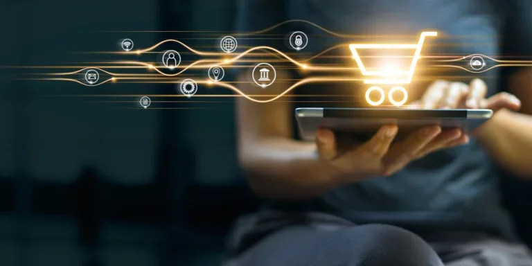 Man using tablet with shopping cart icon