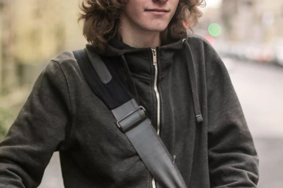 Man with a full mane in cycling jacket