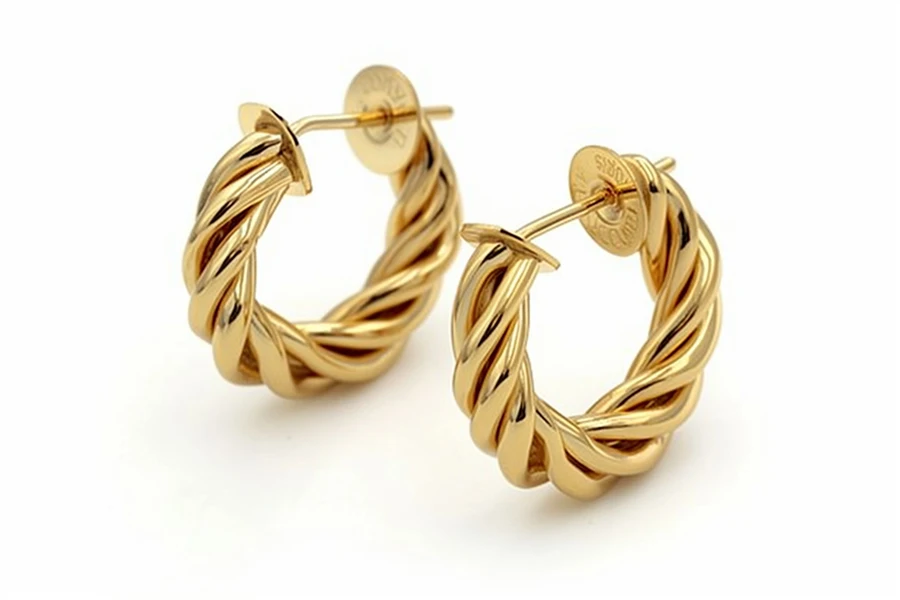 pair of croissant-shaped huggie earrings.