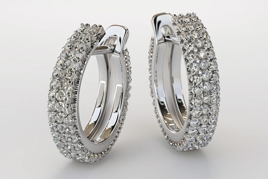pair of silver huggie earrings.