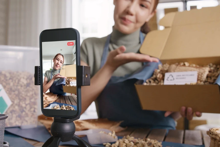 Person showing off eco-friendly packaging on camera