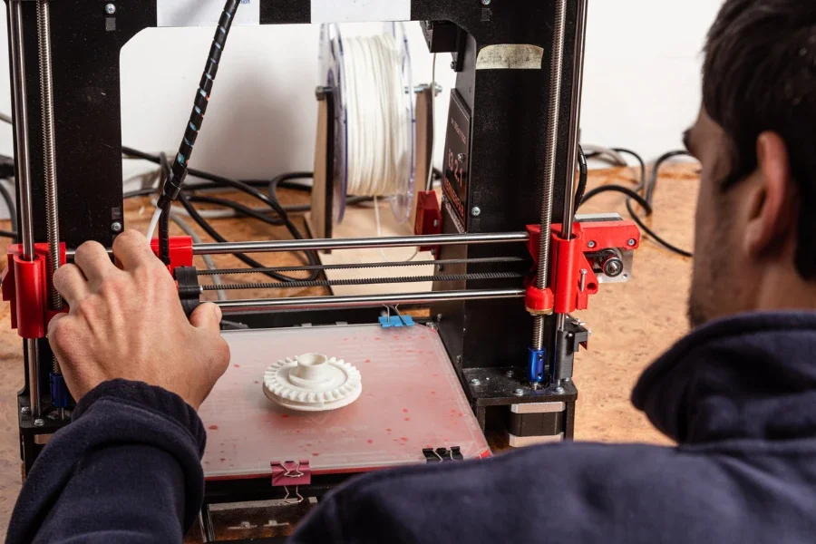 Person working on a 3D printer