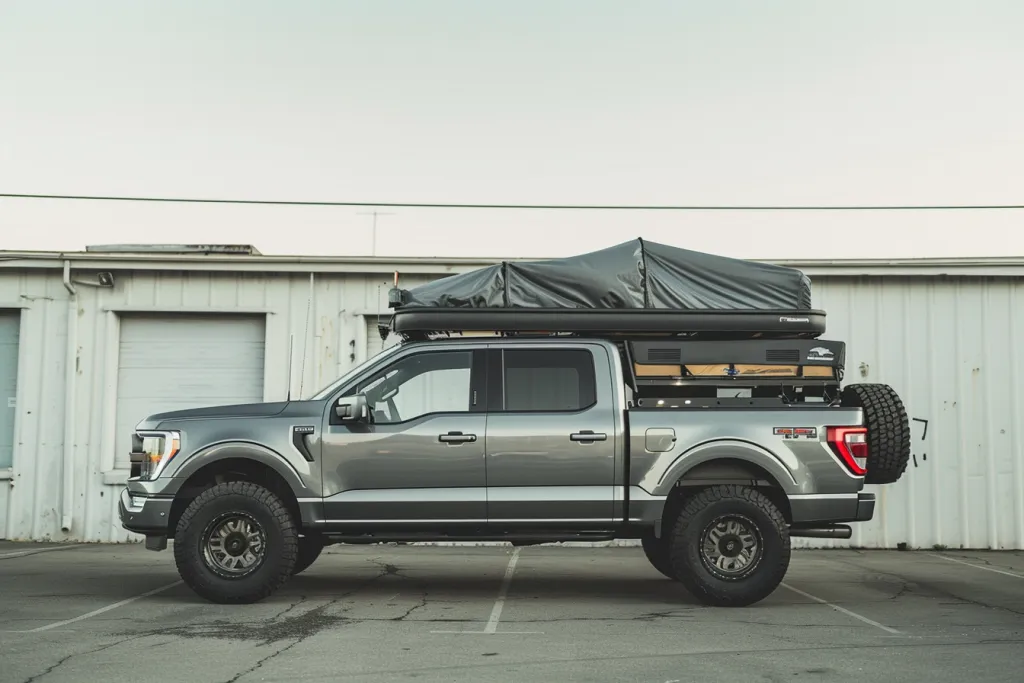 side view of the truck with roof rack and hardtop pop up tent on top