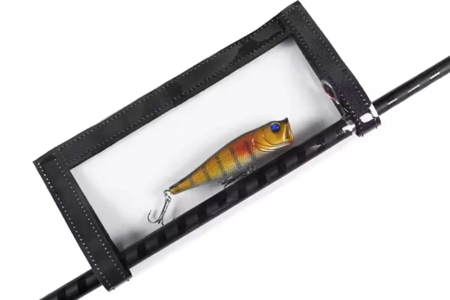 Transparent lure wrap attached to black fishing rod