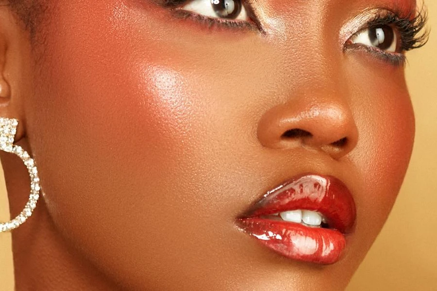 Woman showcasing red glossy lips