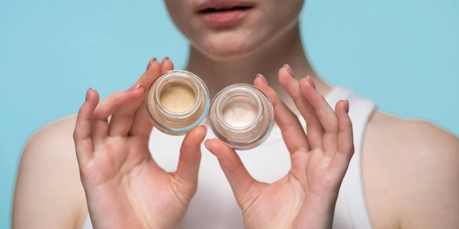 Crop Photo Of Woman Holding Cosmetic Products