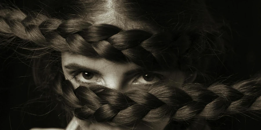 Monochrome Photo of Woman With Braided Hairstyle