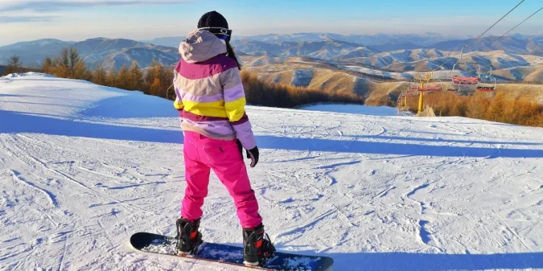 Person Snowboarding on Field