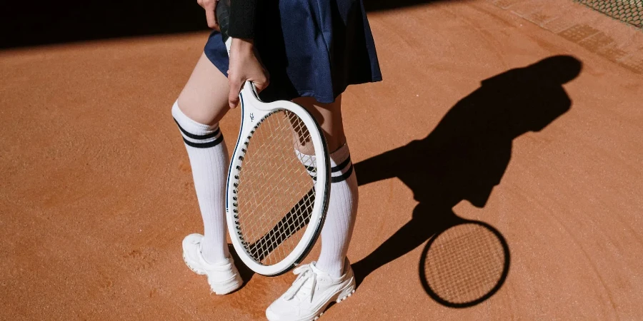 Person Wearing Blue Skirt and Over the Knee Socks