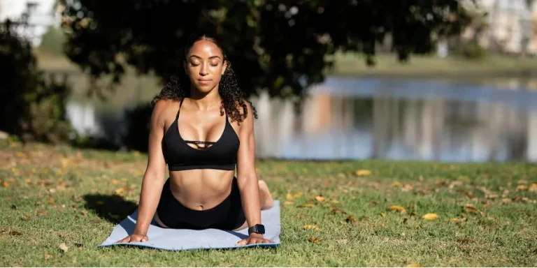 Woman in Black Sports Bra Doing Yoga