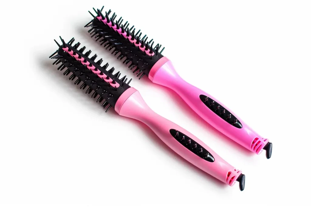 2 pink and black hair brushes for curly long blonde hair