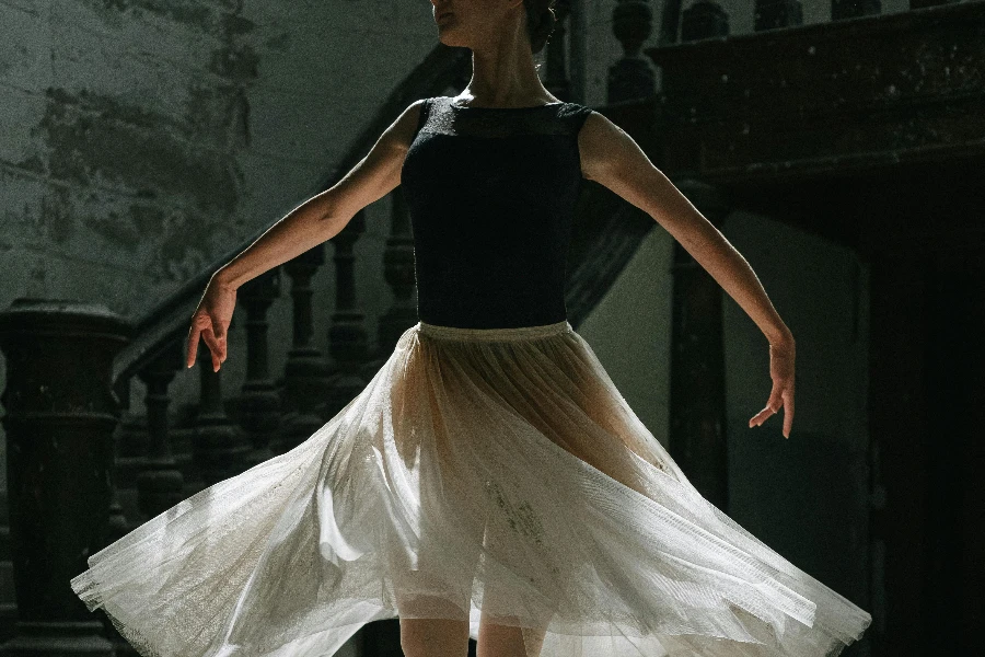 A Ballet Dancer Wearing White Skirt and Pointe Shoes