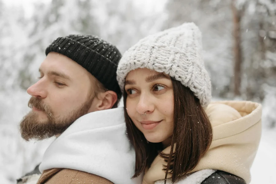 A Couple Wearing Bonnets and Hoodies during Winter 