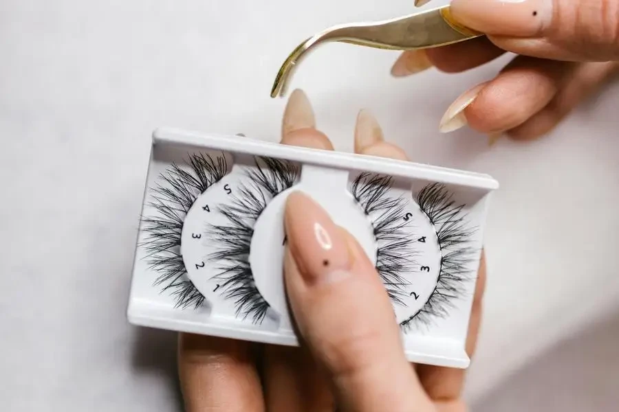 A Person Holding False Eyelashes by RDNE Stock project