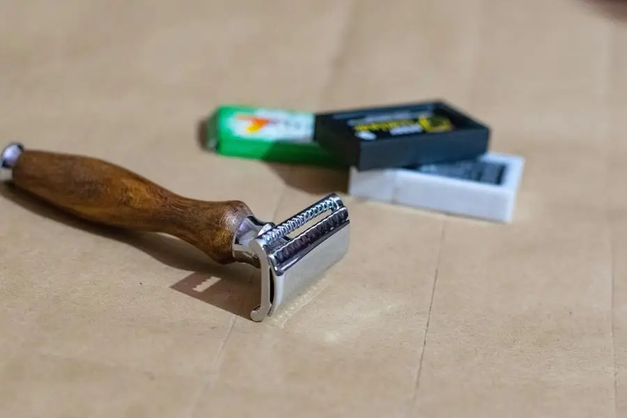 A Semi-Slant Double Edge Safety Razor with a wood handle and sharp feather and derby Blades to achieve a classic Shave by Hamid Roshaan