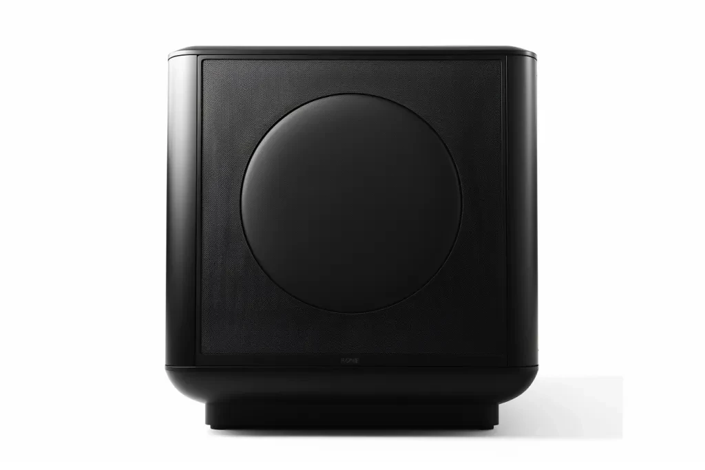 A black subwoofer with rounded edges and a square shape