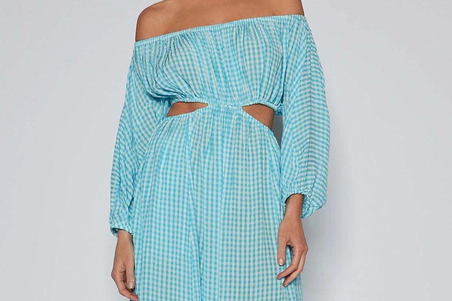 A blue gingham dress with cut-out details
