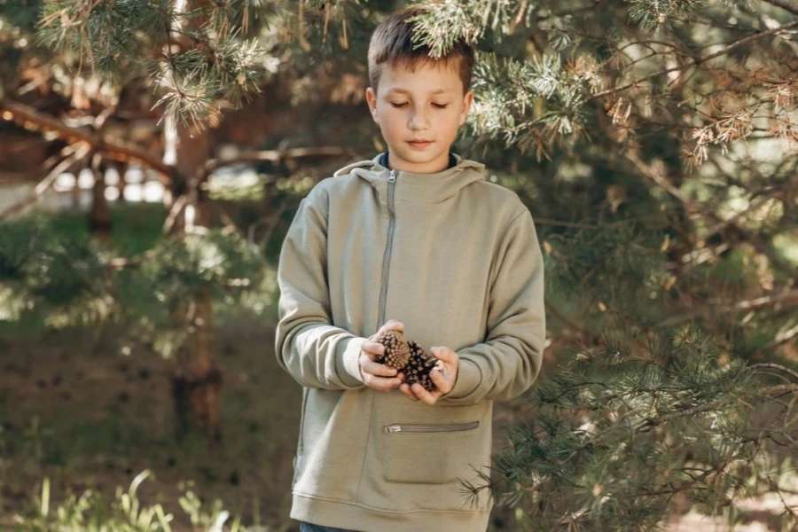 A boy in a pop-over jacket