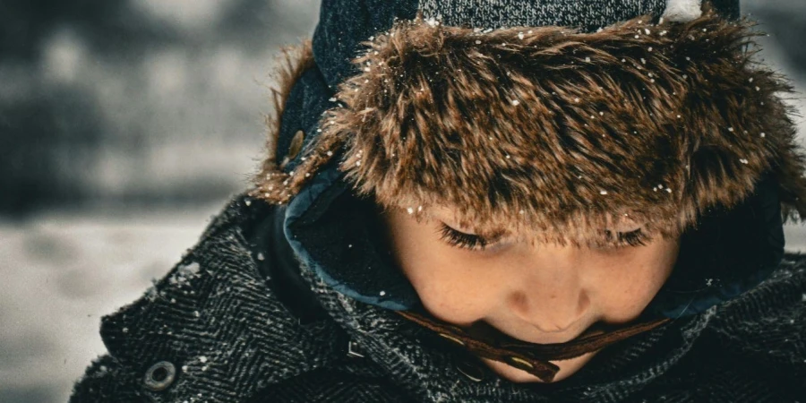 A boy in outdoor wear in the winter