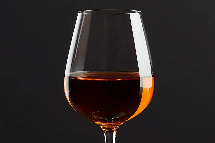 A brandy snifter with some brandy