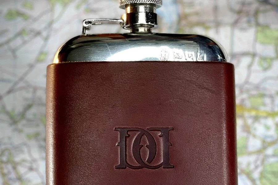 A brown leather-wrapped hip flask
