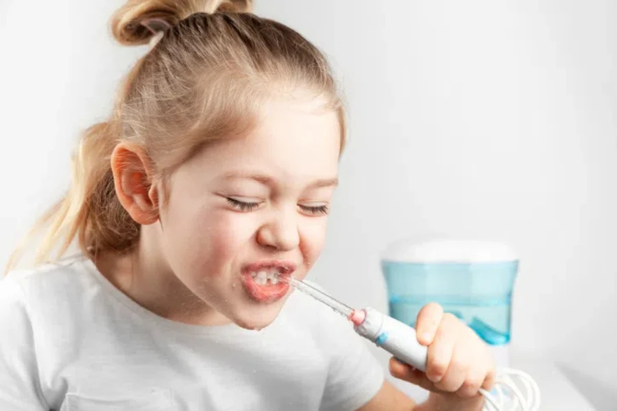 A girl is using Water picks