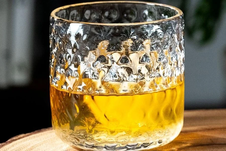 A lowball glass with some alcohol