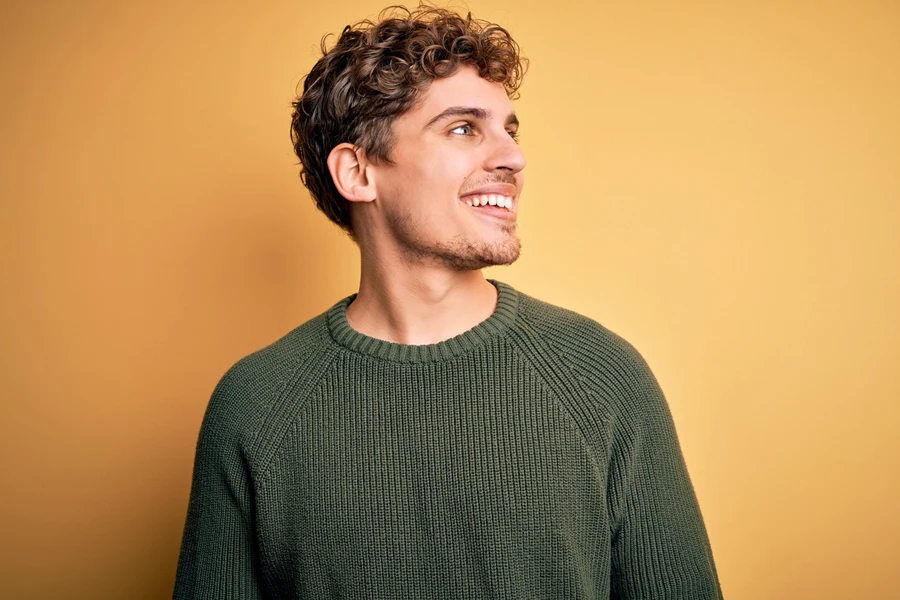 A man in an outdoor-ready sweater