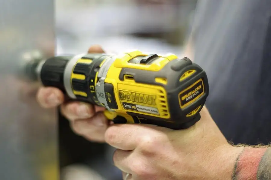 A man using a drill holder