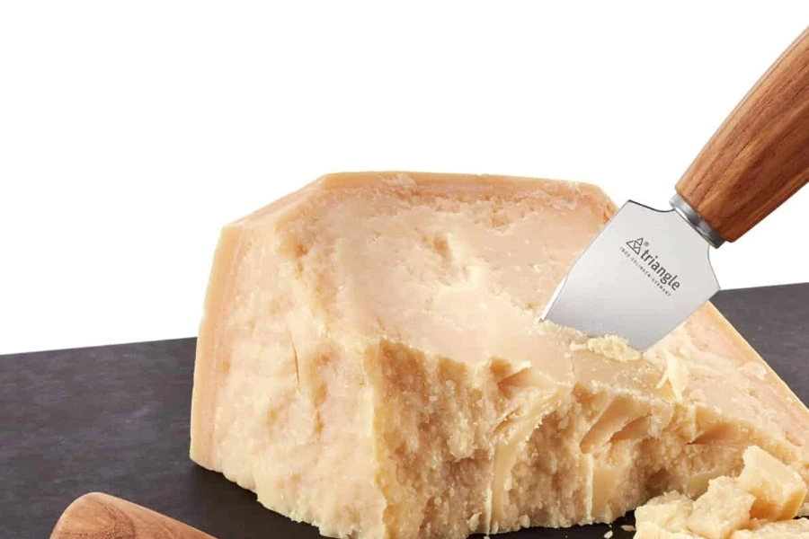 A parmesan knife lodged in a block of cheese