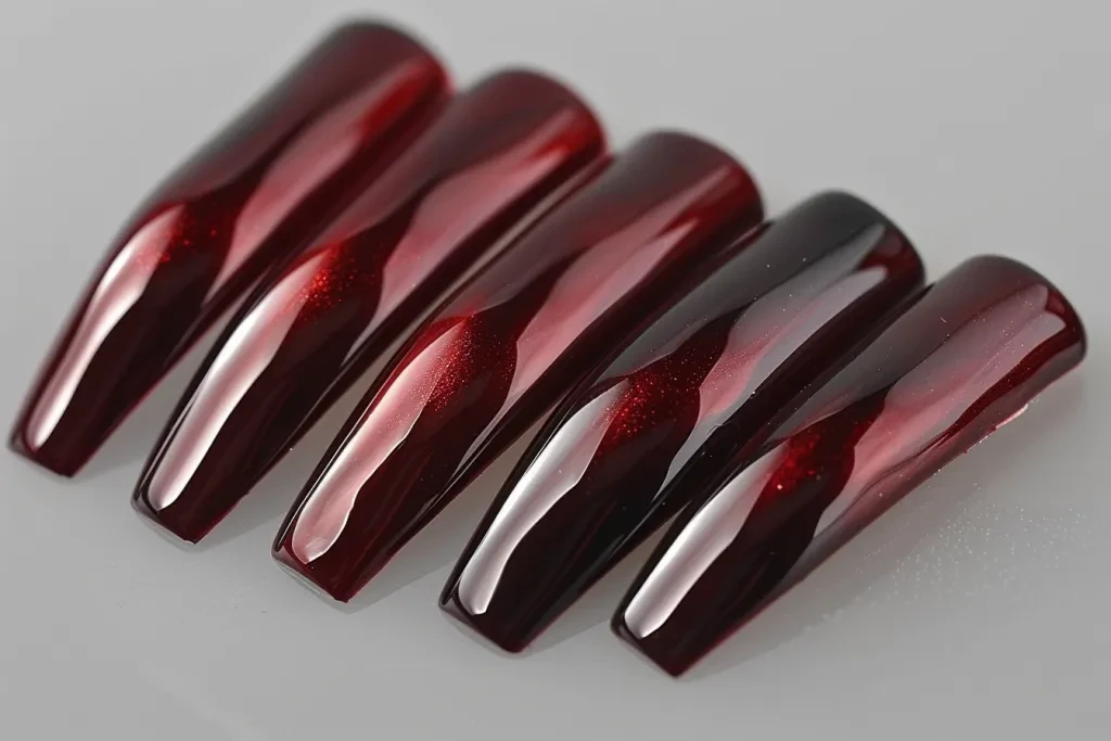 A set of elegant burgundy nails in a long square shape