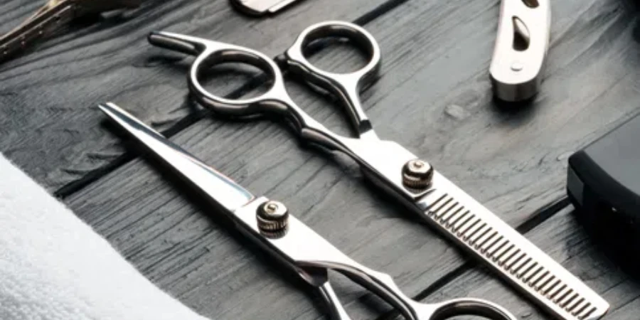 A variety of professional barber tools are neatly arranged