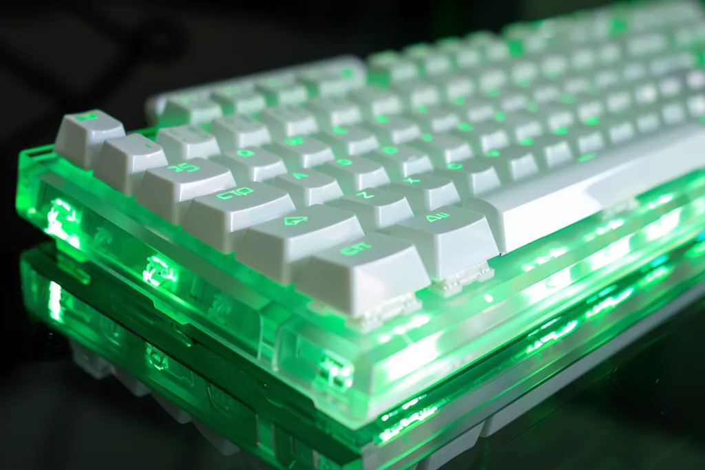 A white and green mechanical keyboard with white keycaps