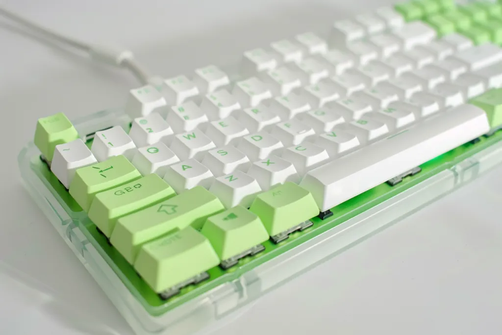 A white and green mechanical keyboard