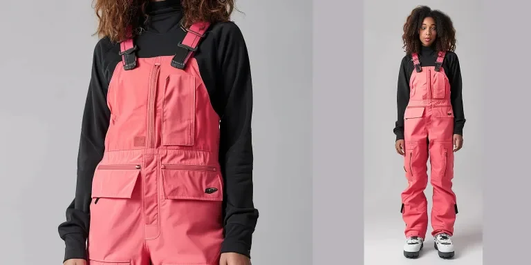 A woman wearing pink snowboard overalls