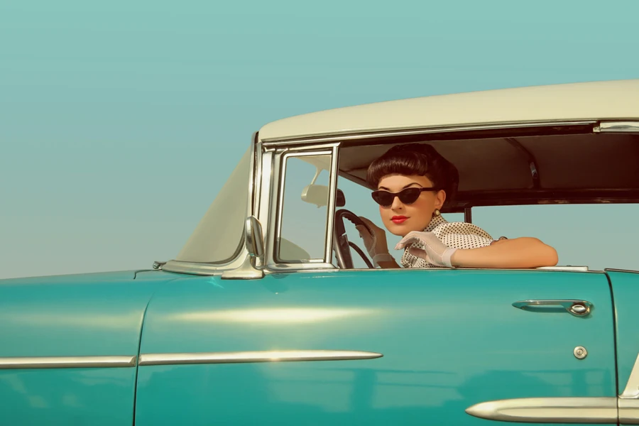 A women in a vintage car