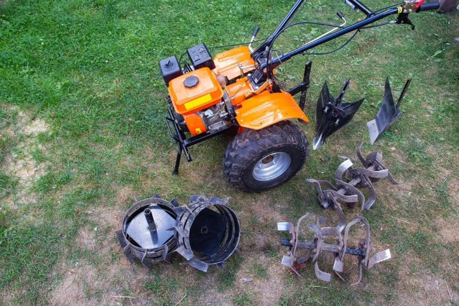 Agricultural walk-behind tractor with a set of attachments, hiller, milling cutters and lugs