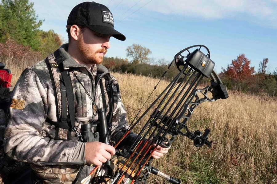 Archer holding a bow with a detachable quiver installed