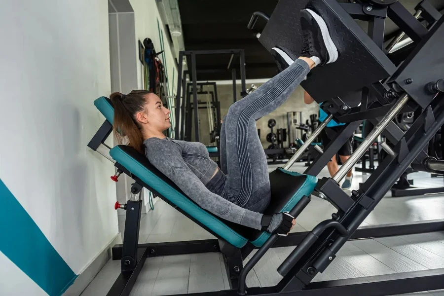 Attractive girl doing exercises in the gym