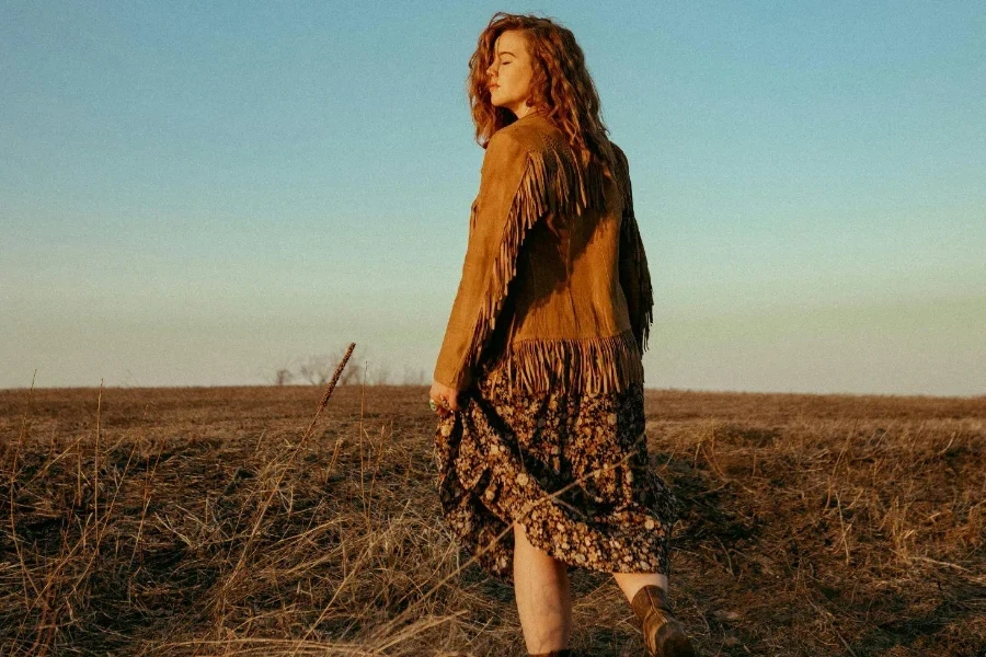 Back View of Redhead Girl Standing in Fields