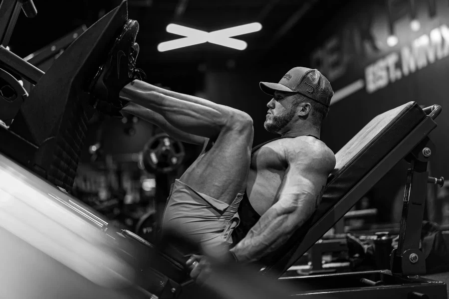 Bodybuilder Using Leg Press at the Gym