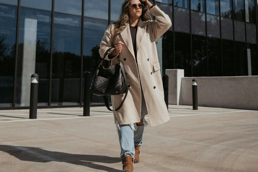 a woman is wearing a peacoat