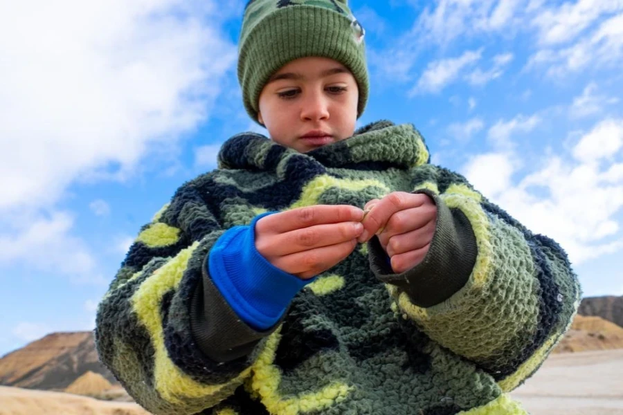 Boy in trendy, warm outdoor wear