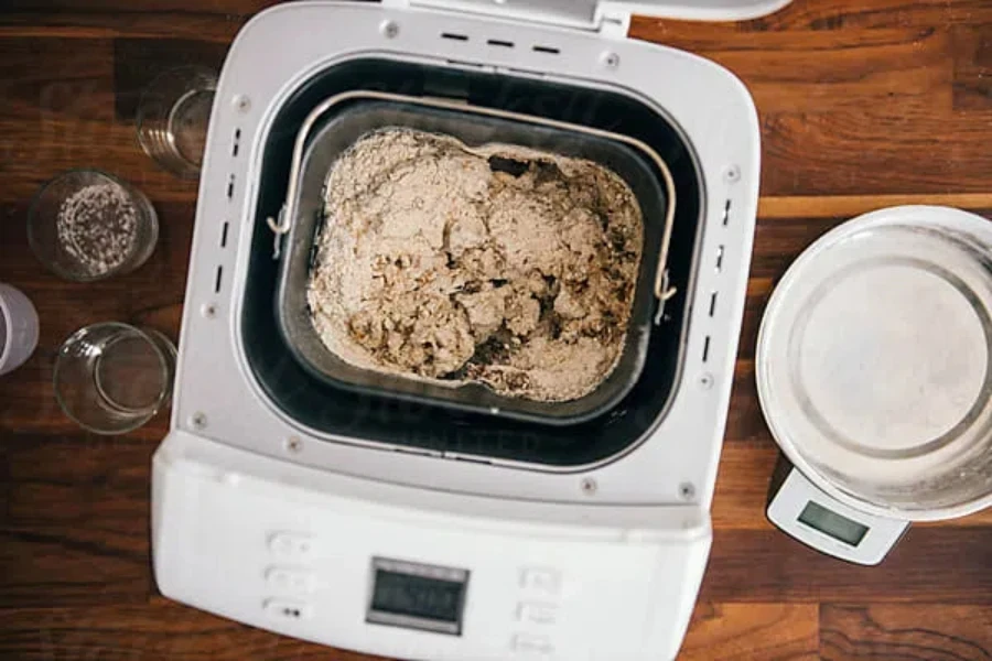 Bread maker kneading dough by Pixel Stories on Stocksy (Stocksy Content License)