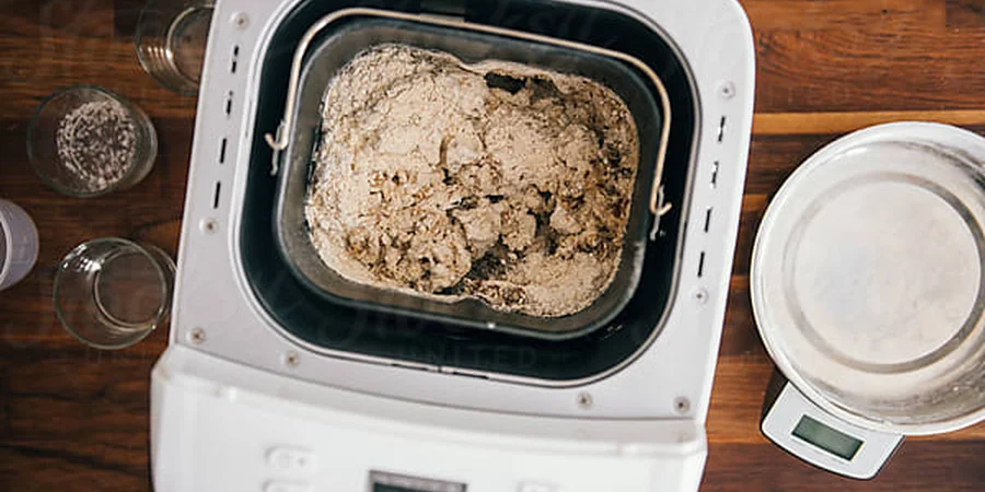 Bread maker kneading dough by Pixel Stories on Stocksy (Stocksy Content License)