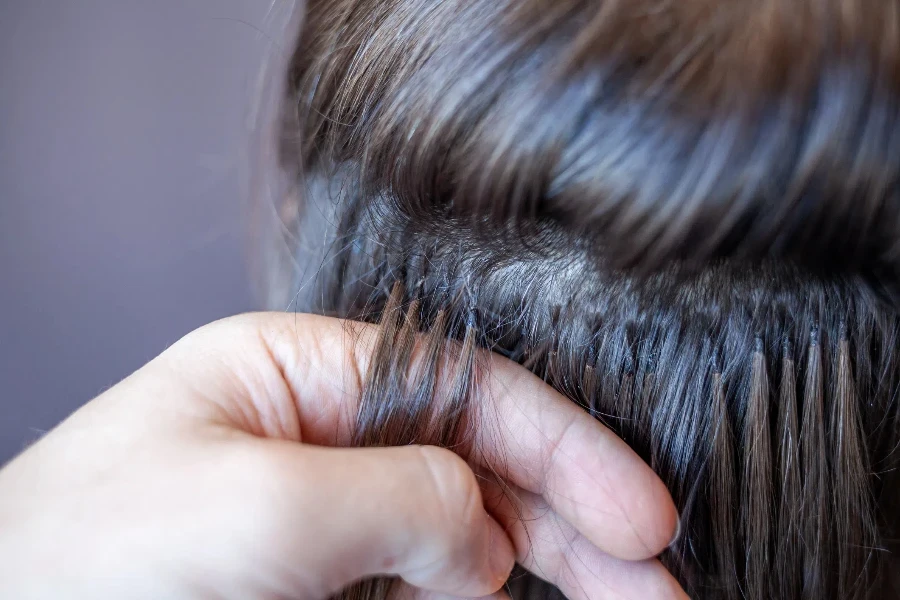 Bundles of hair extensions on a woman's head