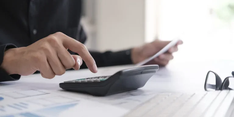 Business man using calculator finance and accounting concept