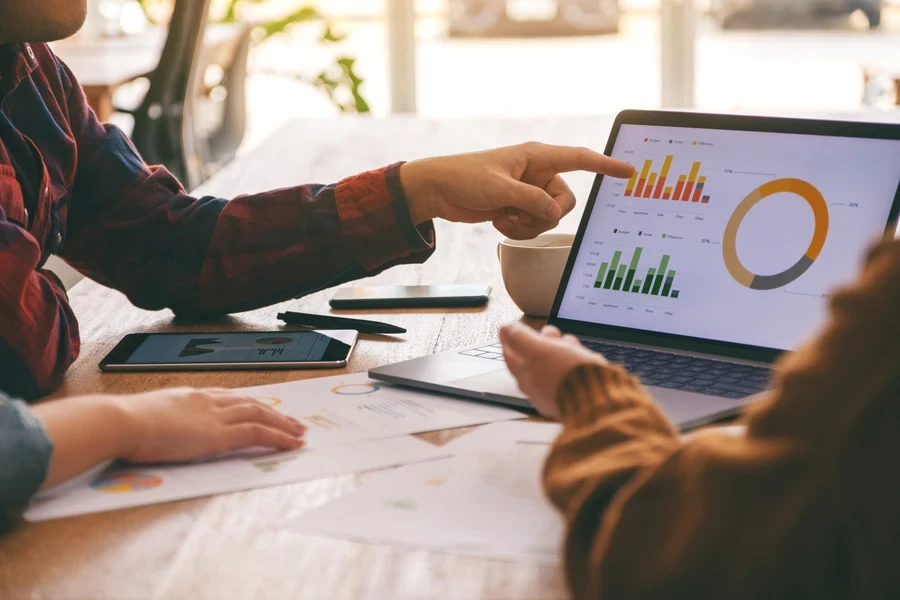 Businesspeople reading and analyzing charts